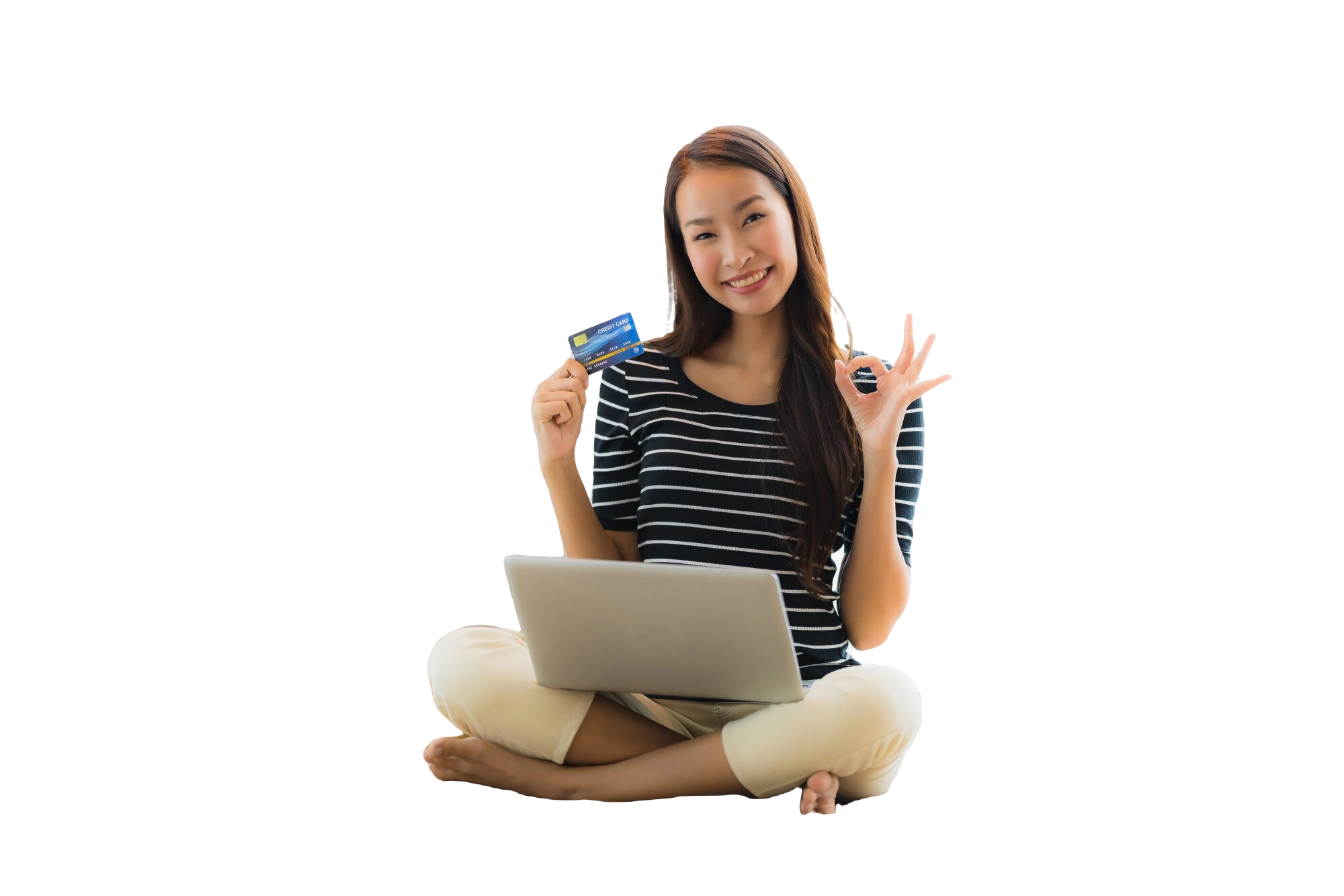 Customer holding a payment card beside a laptop