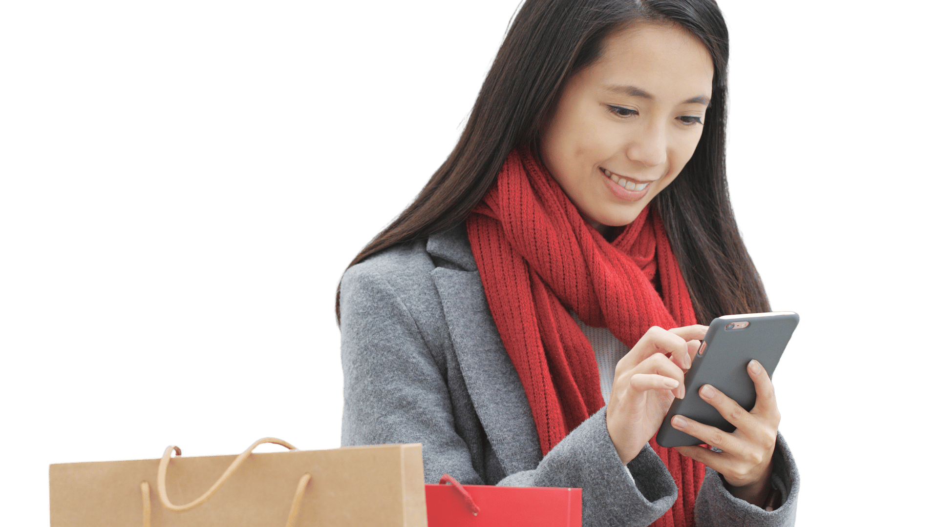 Shopper using a phone beside shopping bags